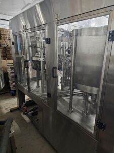 Norland Filler, Capper, Torquer and Line Control w/ Touchscreen, with Triumph 5000 Hepa Air System for Feed Air Conveyor, Post Fill Rinsing System Post Rinse Auto Bottle Dryer